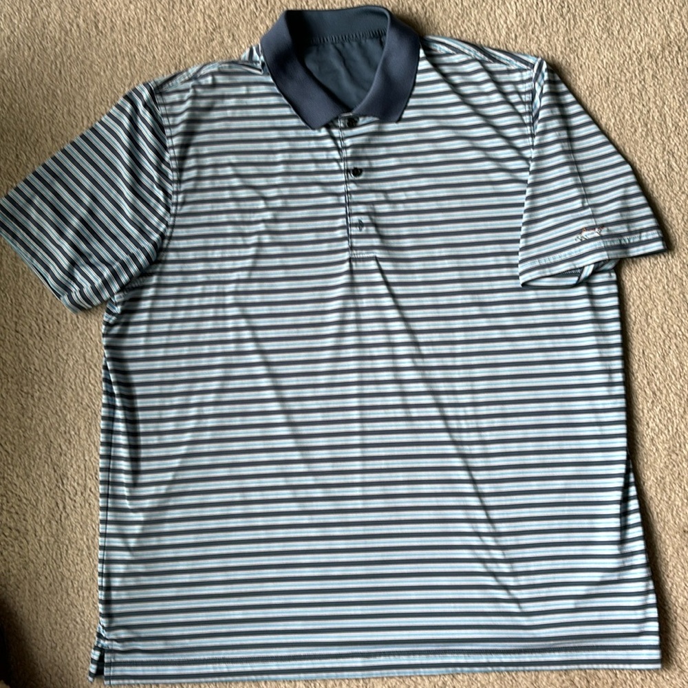 Blue striped Greg Norman golf shirt